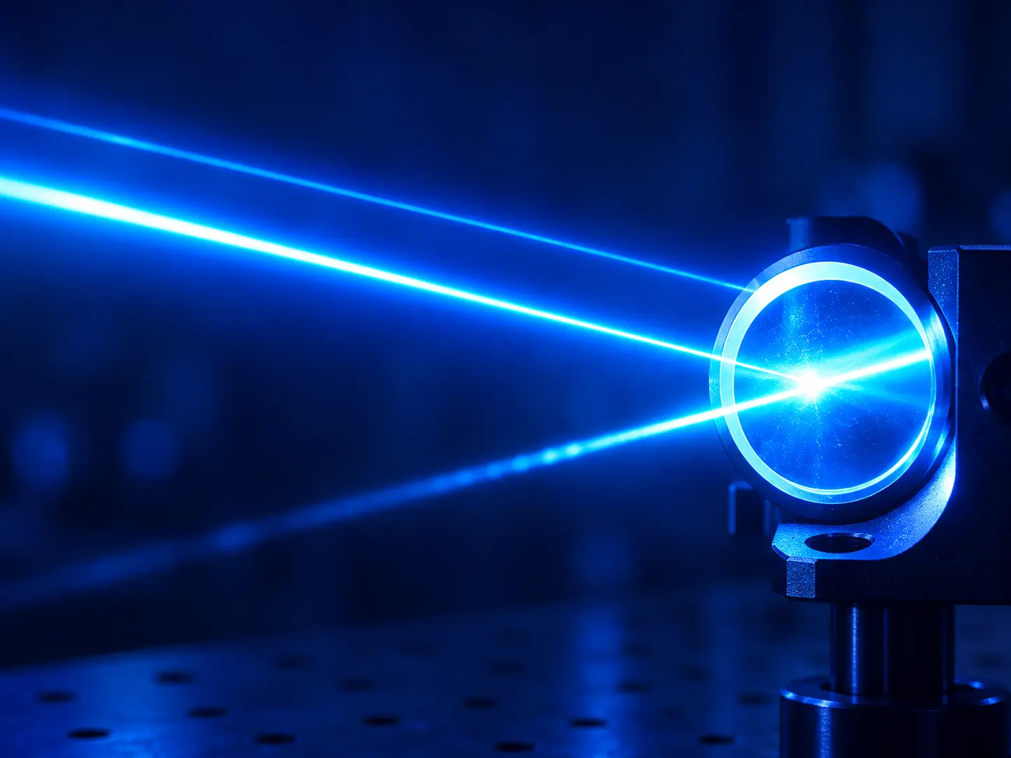 Blue laser beams passing through a precision optical element